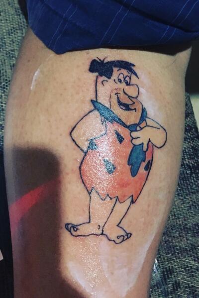 20 Amazing Fred Flintstone Tattoo Designs with Meanings and Ideas  Body  Art Guru