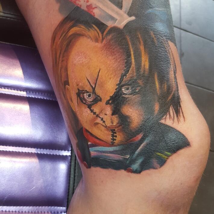 Chucky Head and Knife Tattoo