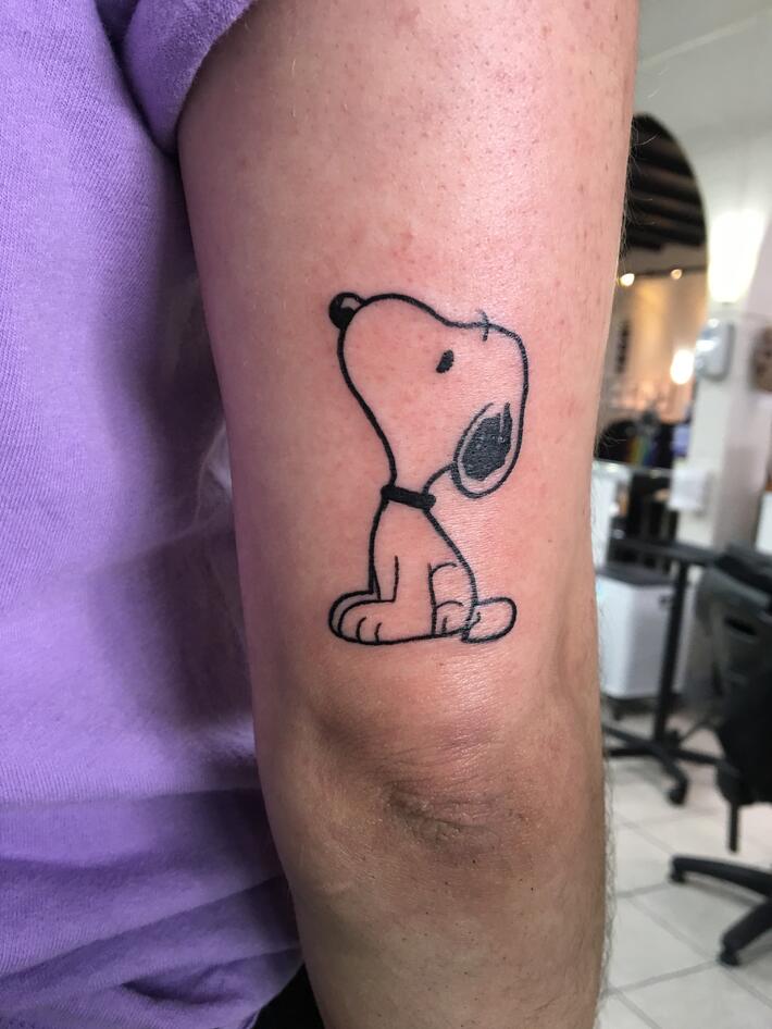 Snoopy With Gun Tattoo On Right Shoulder