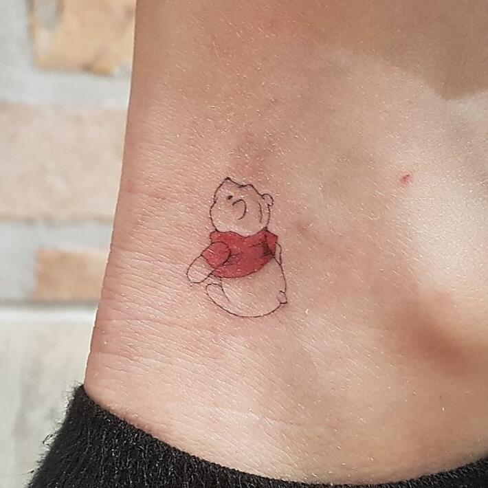 Pooh Bear tattoo on the shoulder